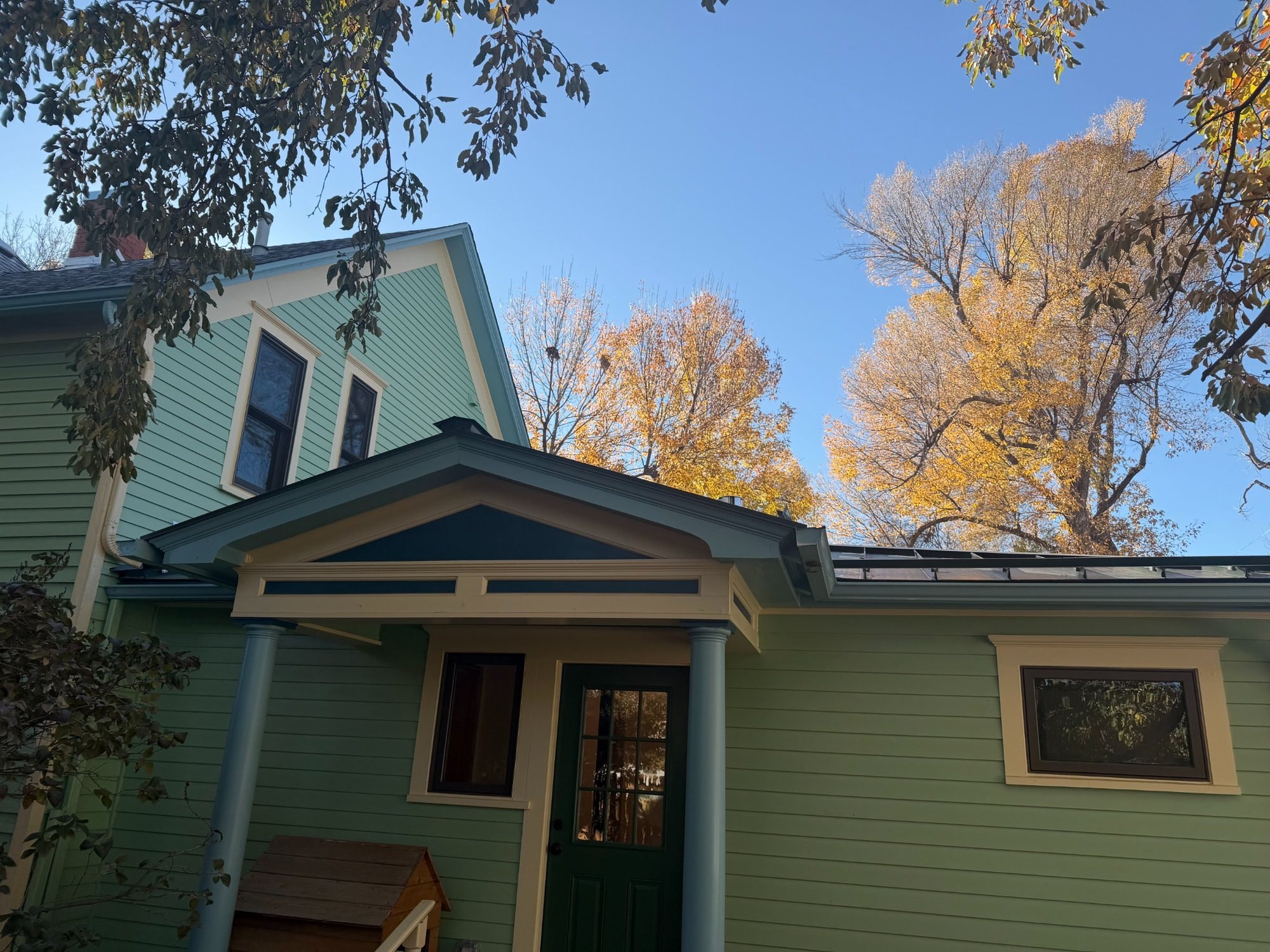 Standing-seam metal roofing with custom roof-plane transitions